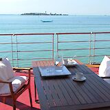 The sundeck offers a comfortable space to unwind, dine outdoors, and take in the scenery along the journey.