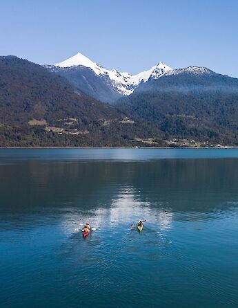 Paddling beneath snow-capped volcanoes in the Lake District.