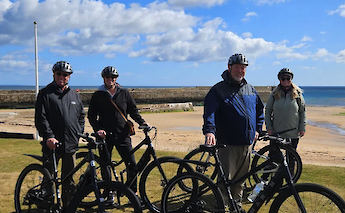 Bike tour group at the beach, St Andrews. CC:TO