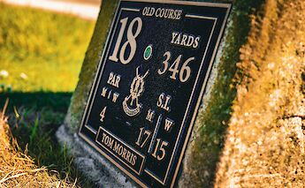 Golf sign on the Old Course of St Andrews. Unsplash@Ryan Caven