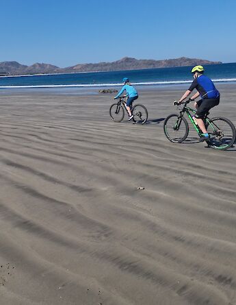 Cycling across the wide sands of Costa Rica’s Pacific coast. toGB