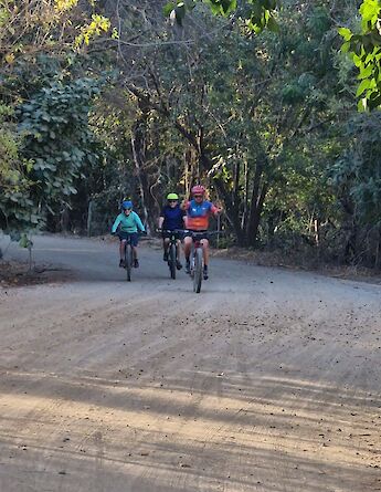Cycling through shaded backroads near the Nicoya Peninsula. toGB