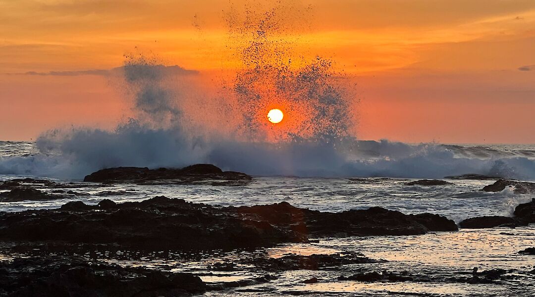 Pacific sunset over the rocky shores of Guanacaste. cc-Heather