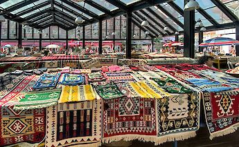 Rugs for sale in the New Bazaar, Tirana, Albania. Linda Gerbec@Unsplash