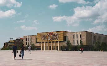 Walking across Skanderbeg Square, Tirana, Albania. B@Unsplash