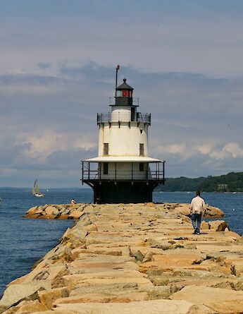 Walking along the rocks to Spring Point Ledge Light, Maine, USA. Lee Lawson@Unsplash