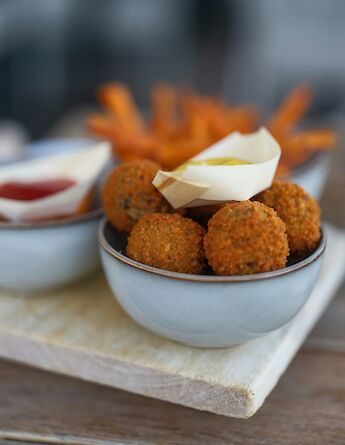 Bitterballen - crispy, deep-fried savory bites filled with a rich beef ragout. Haberdoedas@unsplash