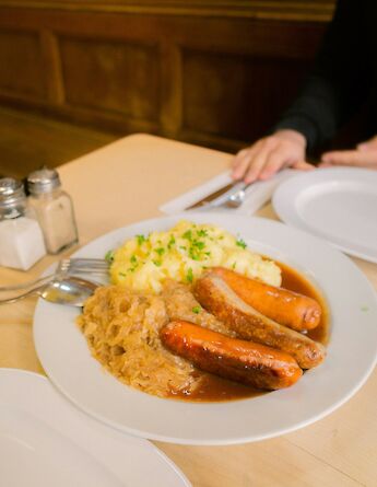 Classic German sausages with sauerkraut and potatoes. MinyeongJeong@unsplash