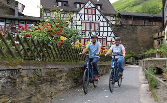 Cycling through historic Bacharach in the Middle Rhine Valley. toBBT
