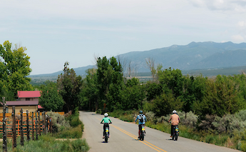 Cycling in a row on the Taos e-bike tour, New Mexico, USA. CC:TO