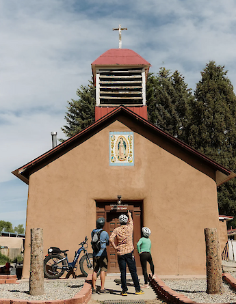 Looking at a church on the Taos e-bike tour, New Mexico, USA. CC:TO