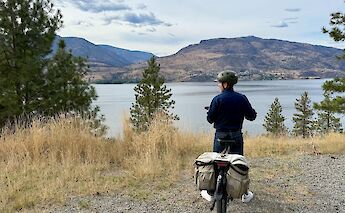 Pausing on the e-bike by Okanagan Lake. CC:TO