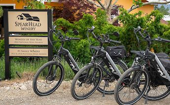 E-bikes lined up outside Spearhead Winery. CC:TO